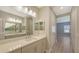 Spacious bathroom with double vanity, quartz counters, and ample lighting at 18137 Franklin Park Ct, Venice, FL 34293