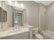 Bathroom featuring a vanity with a white countertop, a large mirror, and a shower-tub combo at 18137 Franklin Park Ct, Venice, FL 34293