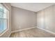 A bright bedroom features wood-look tile floors, neutral walls, and a large window at 18137 Franklin Park Ct, Venice, FL 34293