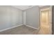 A comfortable bedroom features wood-look tile floors and a closet for storage at 18137 Franklin Park Ct, Venice, FL 34293