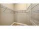 Walk-in closet with wire shelving and tiled floor at 18137 Franklin Park Ct, Venice, FL 34293