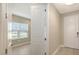 Bright entryway featuring tiled floors and a clear view into an adjacent room through a doorway at 18137 Franklin Park Ct, Venice, FL 34293