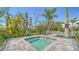 Relaxing hot tub surrounded by lush landscaping, offering a private and tranquil experience at 18137 Franklin Park Ct, Venice, FL 34293