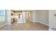 A bright, modern kitchen with stainless steel appliances and a connected living space at 18137 Franklin Park Ct, Venice, FL 34293