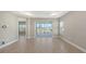 Bright living room with tile floors, recessed lighting, and access to other rooms at 18137 Franklin Park Ct, Venice, FL 34293