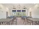 Community lounge area with stylish decor, comfortable seating, and views of the outdoor scenery at 18137 Franklin Park Ct, Venice, FL 34293