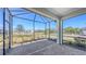 Screened-in patio with brick flooring, providing a relaxing outdoor living space with neighborhood views at 18137 Franklin Park Ct, Venice, FL 34293