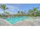 Bright, inviting pool area with ample lounge seating and a pergola, perfect for relaxation at 18137 Franklin Park Ct, Venice, FL 34293
