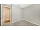 Carpeted bedroom with natural light and neutral walls offering versatility at 18297 Vizcaya Ct, Venice, FL 34293