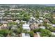 An aerial view of a lush residential area with mature trees and diverse housing styles at 1879 Hibiscus St, Sarasota, FL 34239