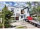 Exterior view of house with construction equipment highlighting modern design and construction materials at 1879 Hibiscus St, Sarasota, FL 34239