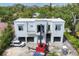 Modern home exterior showcasing clean lines, contemporary design and white exterior paint at 1879 Hibiscus St, Sarasota, FL 34239