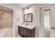 Bathroom with a vanity, tile shower, and an exterior door at 22201 Olean Blvd, Port Charlotte, FL 33952