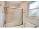Bathroom featuring tiled shower, sliding glass door, and modern fixtures at 22201 Olean Blvd, Port Charlotte, FL 33952