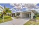 Single-story home with an attached carport and well-manicured landscaping at 22201 Olean Blvd, Port Charlotte, FL 33952