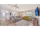 Bright living room showcasing new floors, comfortable seating, and an open floor plan at 22201 Olean Blvd, Port Charlotte, FL 33952