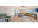 Inviting living room with modern floors, stylish sofas, and plenty of natural light at 22201 Olean Blvd, Port Charlotte, FL 33952