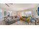 Cozy living room with stylish sofas, lots of natural light, and modern flooring at 22201 Olean Blvd, Port Charlotte, FL 33952