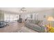 Spacious living room with sliding glass doors to lanai and updated flooring at 22201 Olean Blvd, Port Charlotte, FL 33952