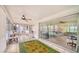 Bright sunroom featuring tile floors, indoor/outdoor flow, and plenty of natural light at 22201 Olean Blvd, Port Charlotte, FL 33952
