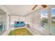 Bright sunroom featuring tile floors, indoor/outdoor flow, and plenty of natural light at 22201 Olean Blvd, Port Charlotte, FL 33952
