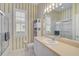 Traditional bathroom with shower and a large vanity area at 2311 Falcon Trace Ln, Nokomis, FL 34275