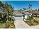 Well-maintained home with a tile roof, two-car garage, and beautiful landscaping at 2311 Falcon Trace Ln, Nokomis, FL 34275