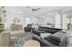 Open-concept living room showcasing hardwood floors, and modern furnishings at 2311 Falcon Trace Ln, Nokomis, FL 34275