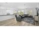 Spacious living room showcasing wood floors and comfortable seating area at 2311 Falcon Trace Ln, Nokomis, FL 34275