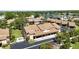 Aerial view of community featuring lush landscaping, pond, assigned parking, and well-maintained grounds at 2347 Beneva Ter # 2251, Sarasota, FL 34232