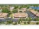 Aerial view of the community, showcasing the assigned covered parking and pond at 2347 Beneva Ter # 2251, Sarasota, FL 34232