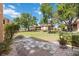 Outdoor patio area features a serene courtyard surrounded by lush landscaping at 2347 Beneva Ter # 2251, Sarasota, FL 34232