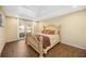 Inviting bedroom featuring a large bed, tray ceiling, and natural light from the windows at 2347 Beneva Ter # 2251, Sarasota, FL 34232