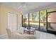 Bright sunroom features a ceiling fan and sliding glass doors showcasing views of the property at 2347 Beneva Ter # 2251, Sarasota, FL 34232