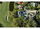 Aerial shot of estate surrounded by golf course, landscaping, and a pond at 236 Saint James Park, Osprey, FL 34229