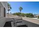 Outdoor balcony with lounge chairs offering picturesque views of lush greenery and palm trees at 236 Saint James Park, Osprey, FL 34229