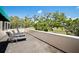 Enjoy the view from this balcony with chairs overlooking lush green scenery at 236 Saint James Park, Osprey, FL 34229