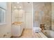 Bright primary bathroom offers marble finishes and a soaking tub at 236 Saint James Park, Osprey, FL 34229