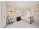 Comfortable bedroom with decorative wallpaper, two windows, and classic furnishings at 236 Saint James Park, Osprey, FL 34229