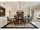 Elegant dining room featuring a large dining table with seating for eight and china cabinet at 236 Saint James Park, Osprey, FL 34229