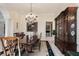 Elegant dining room with chandelier, dining table, and large hutch at 236 Saint James Park, Osprey, FL 34229