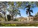 Inviting property with lush landscaping, white fencing, and multiple buildings on the property at 236 Saint James Park, Osprey, FL 34229