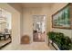 Elegant foyer featuring marble flooring, striped wallpaper, a decorative chandelier, and decorative painting at 236 Saint James Park, Osprey, FL 34229
