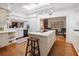 Bright eat-in kitchen features a skylight, center island cooktop, and hardwood floors at 236 Saint James Park, Osprey, FL 34229