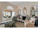 Bright living room boasting a fireplace, comfortable seating, and seamless flow to the outdoors at 236 Saint James Park, Osprey, FL 34229