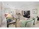 A spacious living room with plush seating, a large TV, and plenty of natural light at 236 Saint James Park, Osprey, FL 34229