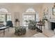 Cozy living room featuring elegant furnishings and large windows for plenty of natural light at 236 Saint James Park, Osprey, FL 34229