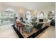 Bright living room featuring a fireplace, built-in shelving, and elegant furnishings at 236 Saint James Park, Osprey, FL 34229