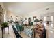 Bright living room with fireplace, elegant decor, and access to outdoor patio through sliding glass doors at 236 Saint James Park, Osprey, FL 34229