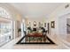 Elegant living room boasting a fireplace, plush seating, and seamless flow to the outdoors at 236 Saint James Park, Osprey, FL 34229